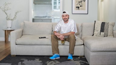 Man on couch with beer glass